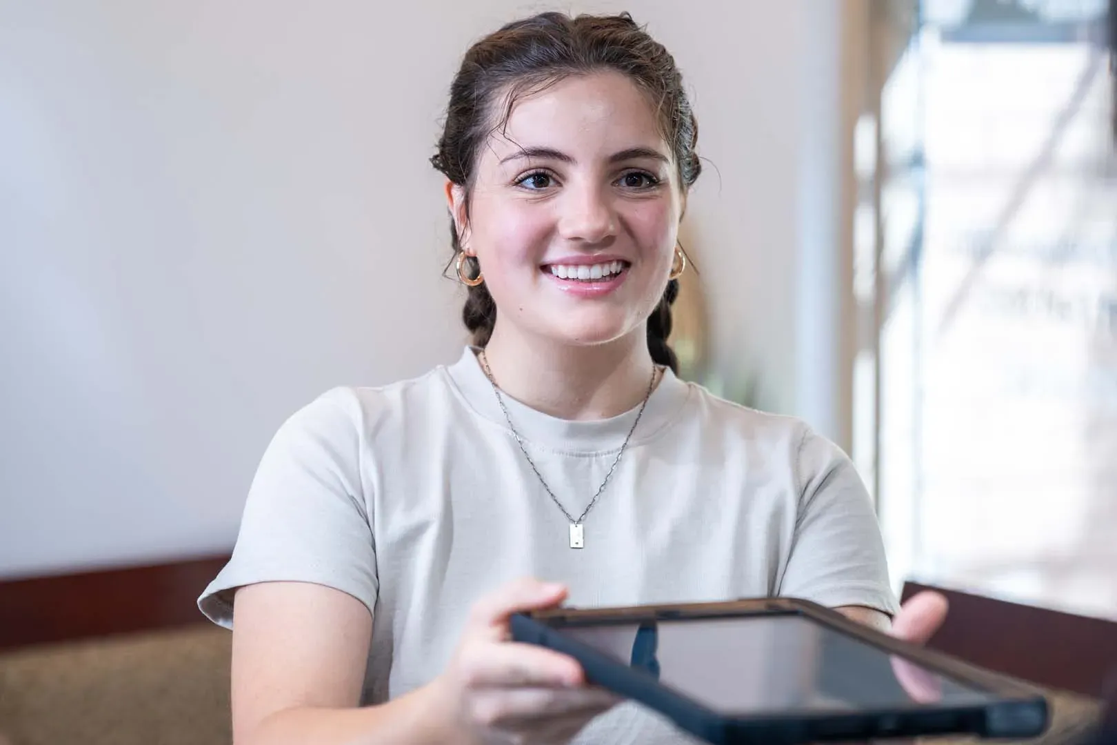 A patient checking in at the front desk